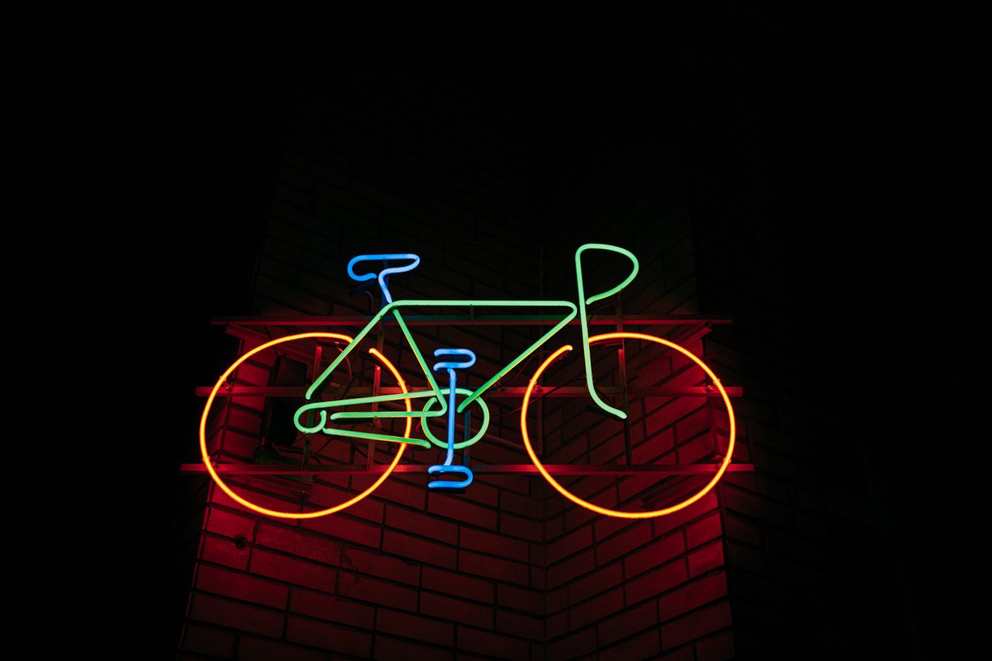 Neon bicycle sign on a wall